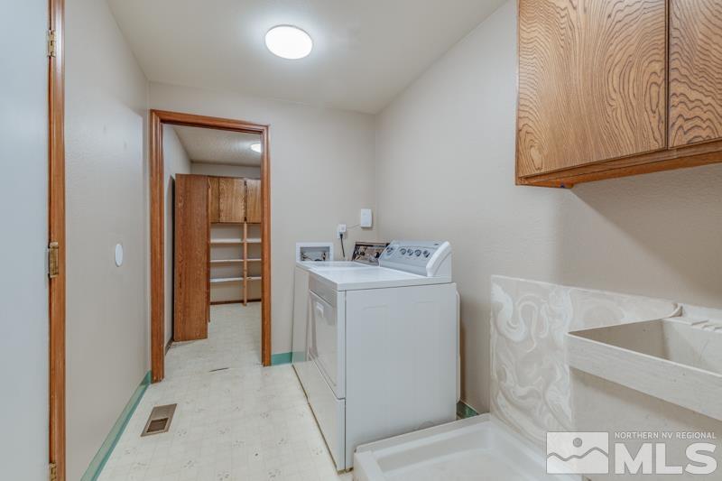 1860 Wendy Way Reno, NV 89509 - Photo 11 of 36 a utility room with a sink washer and dryer