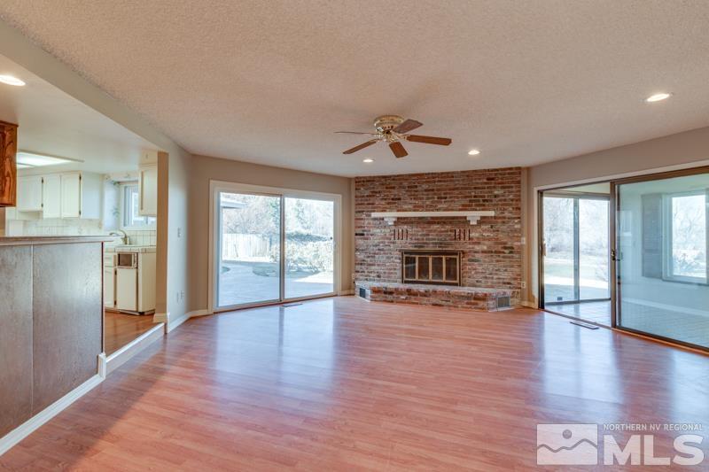 1860 Wendy Way Reno, NV 89509 - Photo 14 of 36 a view of an empty room with window and wooden floor