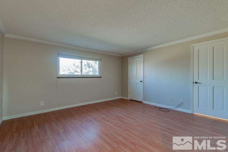 1860 Wendy Way Reno, NV 89509 - Photo 16 of 36 an empty room with wooden floor and windows