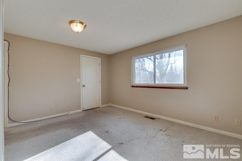 1860 Wendy Way Reno, NV 89509 - Photo 20 of 36 an empty room with windows