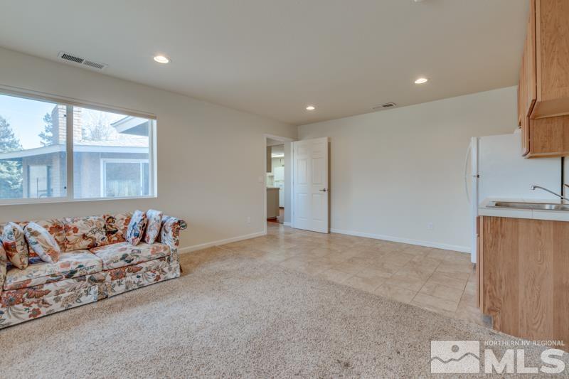 1860 Wendy Way Reno, NV 89509 - Photo 23 of 36 a bed room with a bed and a couch