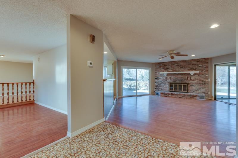 1860 Wendy Way Reno, NV 89509 - Photo 3 of 36 wooden floor in an empty room with a fireplace
