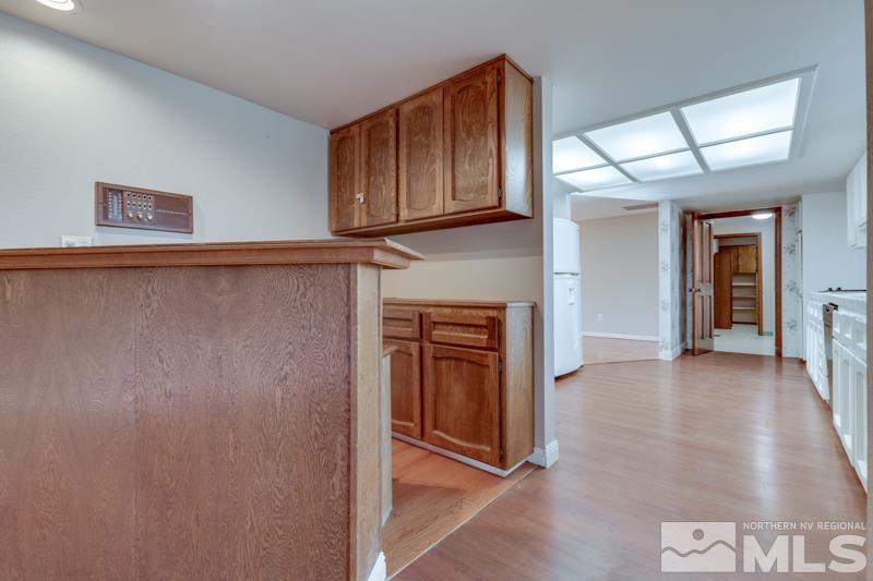1860 Wendy Way Reno, NV 89509 - Photo 10 of 36 a view of a hallway with wooden shelves