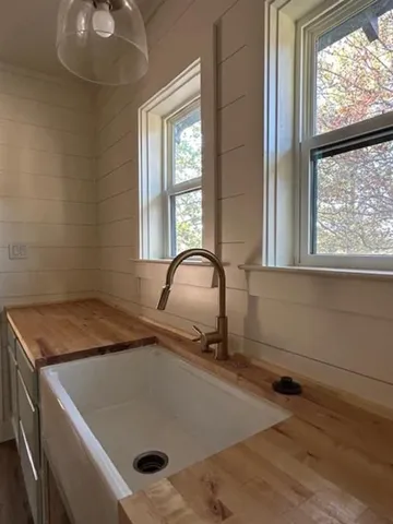 a bathroom with a sink and a window