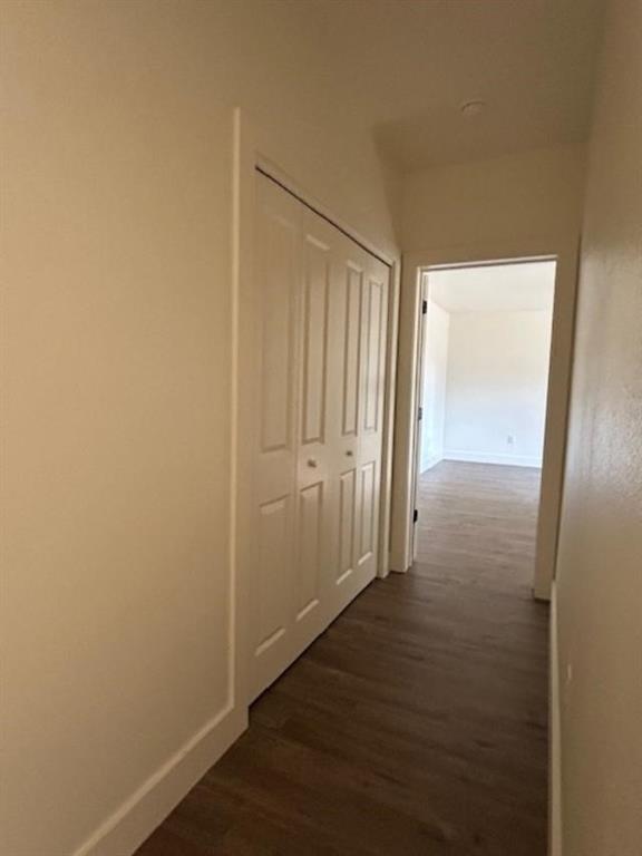 415 West Walnut Street Whitewright, TX 75491 - Photo 19 of 36 an empty room with wooden floor and door