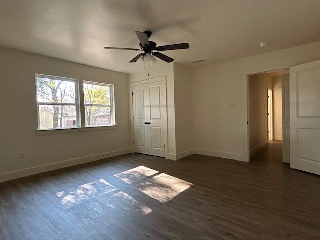 415 West Walnut Street Whitewright, TX 75491 - Photo 21 of 36 a view of an empty room with wooden floor and a window