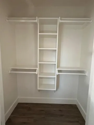 a view of an empty walk in closet
