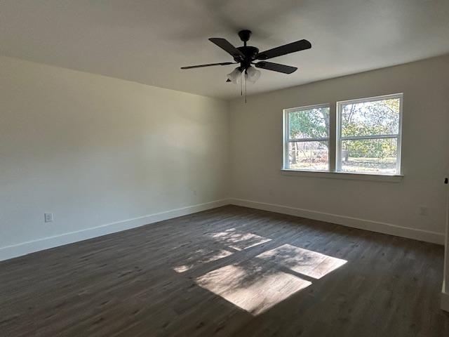 415 West Walnut Street Whitewright, TX 75491 - Photo 23 of 36 a view of an empty room with wooden floor and a window