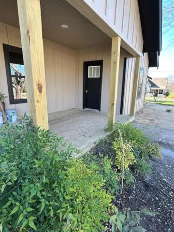 a view of an entrance of house and porch