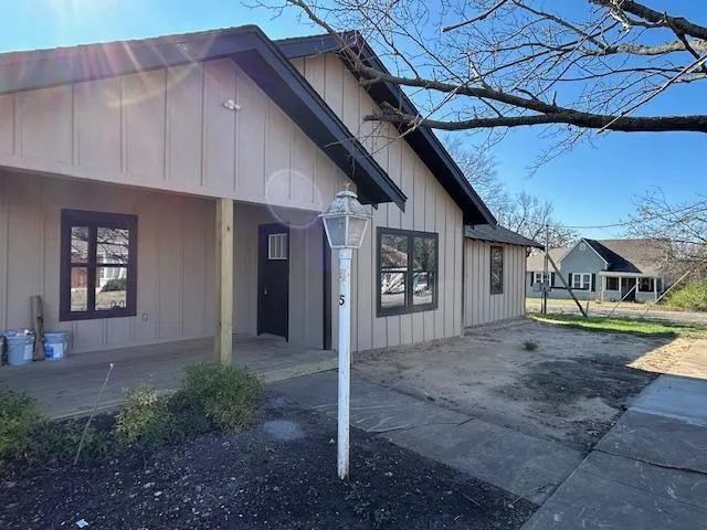 a view of a yard with a tree