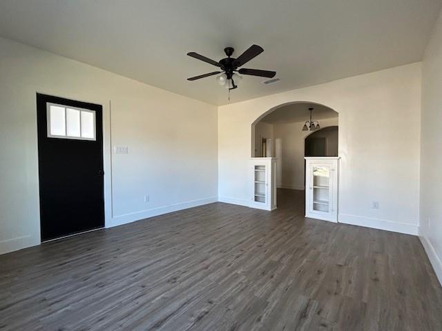 415 West Walnut Street Whitewright, TX 75491 - Photo 5 of 36 a view of a livingroom with wooden floor and a ceiling fan