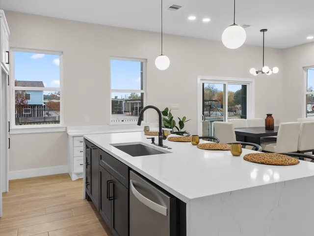 a kitchen with a sink and stove