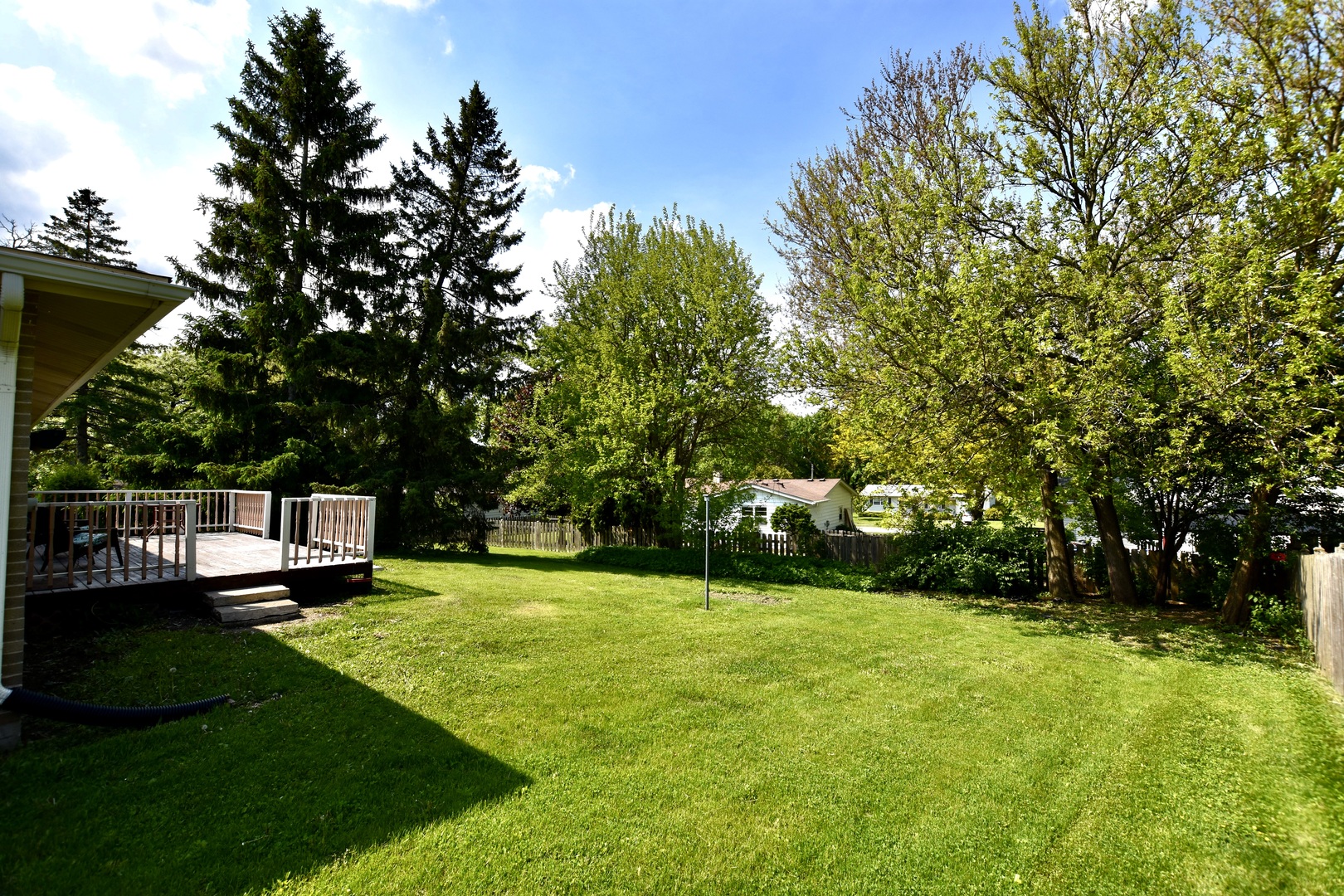 4510 Ashley Drive McHenry, IL 60050 - Photo 6 of 8 a view of a garden with a bench