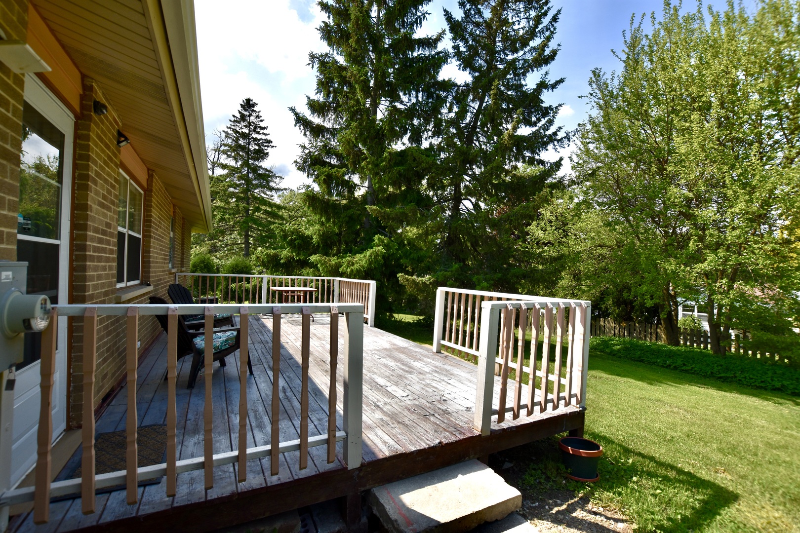 4510 Ashley Drive McHenry, IL 60050 - Photo 7 of 8 a view of balcony with wooden floor and outdoor seating