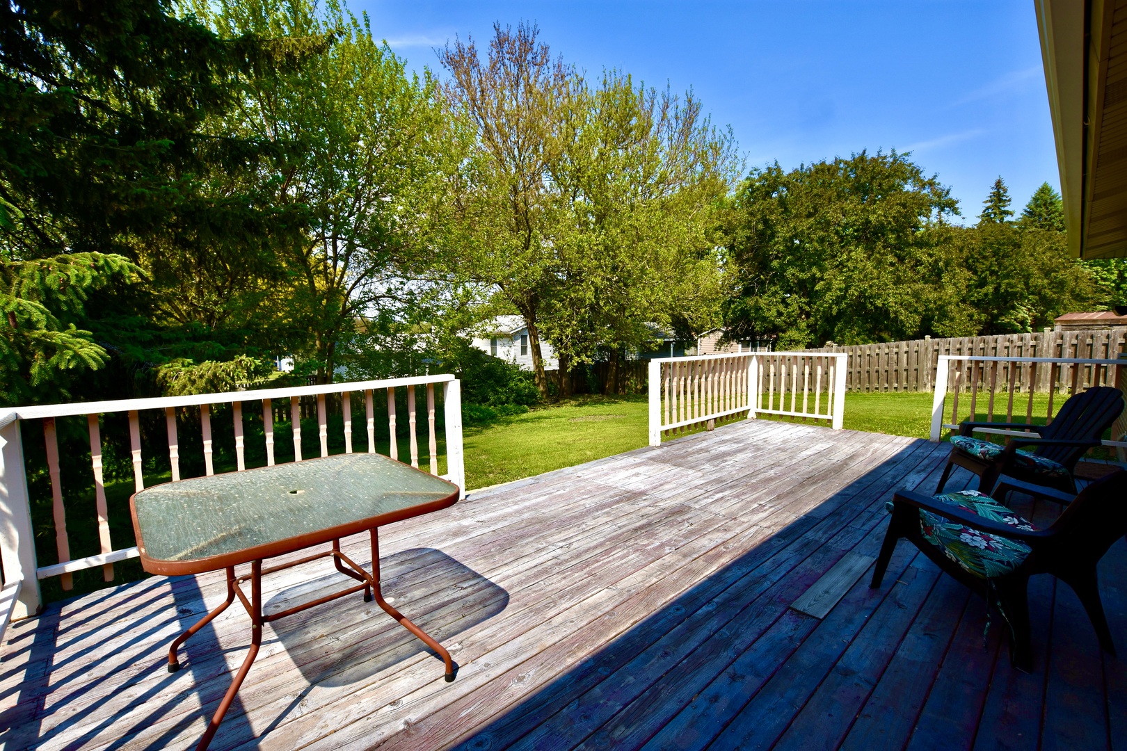 4510 Ashley Drive McHenry, IL 60050 - Photo 8 of 8 a view of a wooden deck with furniture