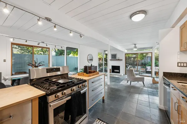 a kitchen with a stove and a refrigerator