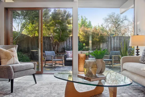 a living room with patio furniture