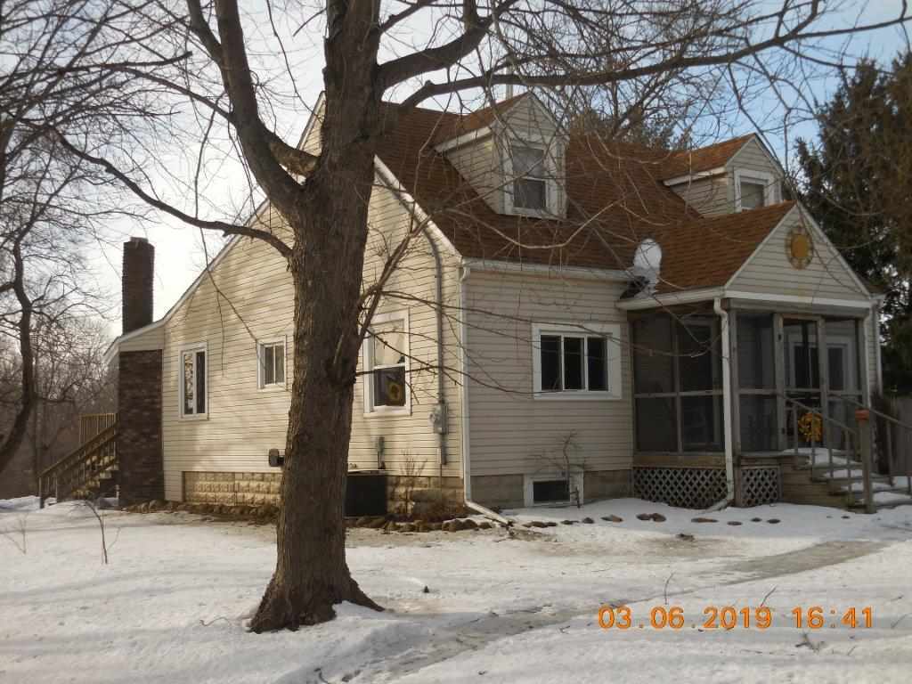 4483 Centerville Road Rockford, IL 61102 - Photo 1 of 24 a front view of a house with a yard