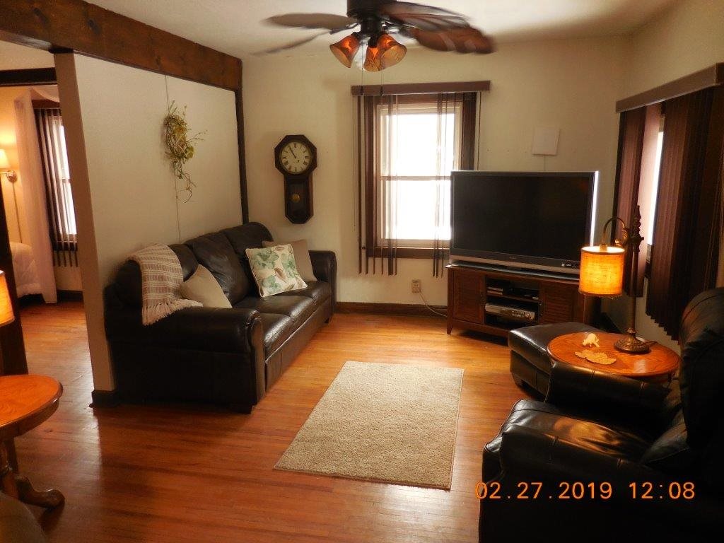 4483 Centerville Road Rockford, IL 61102 - Photo 16 of 24 a living room with furniture and a flat screen tv