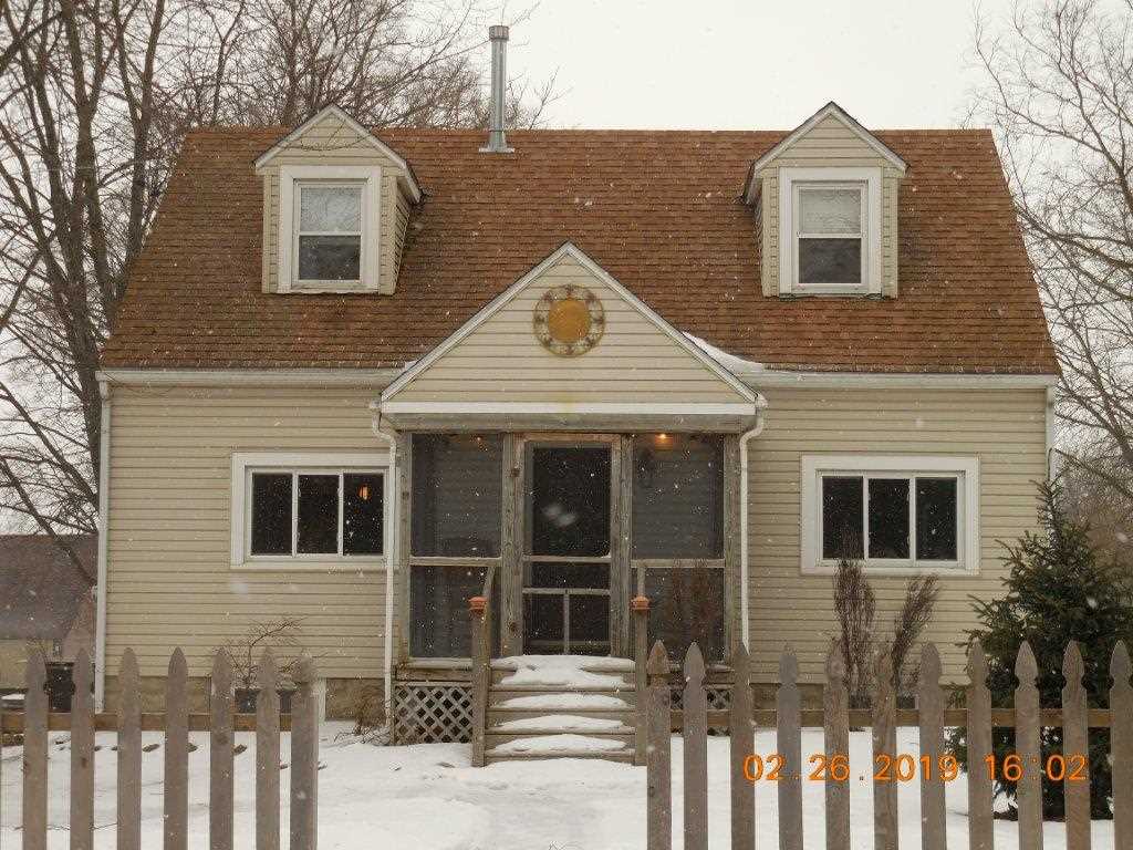 4483 Centerville Road Rockford, IL 61102 - Photo 2 of 24 a front view of a house with a yard