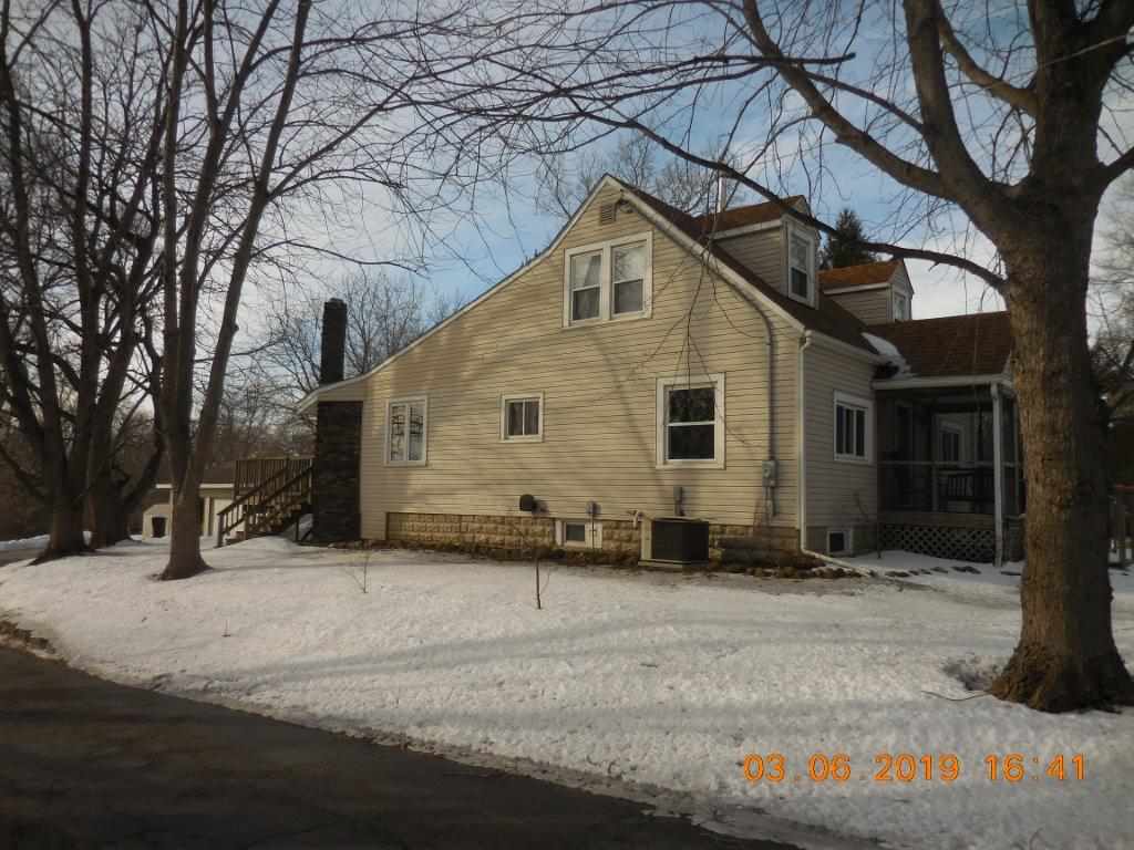4483 Centerville Road Rockford, IL 61102 - Photo 5 of 24 a view of a house with a snow in the yard