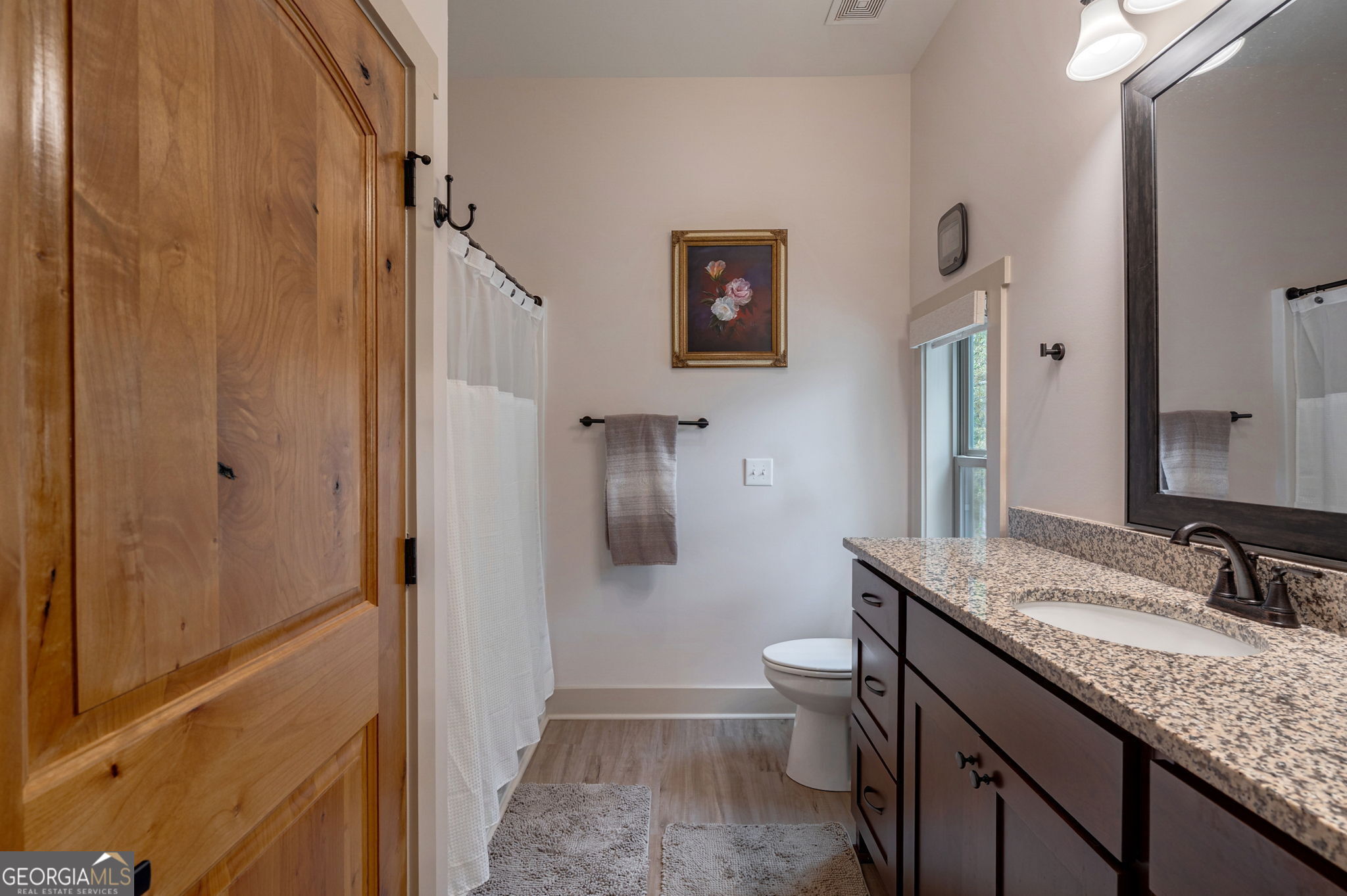 1364 Old Bishop Road Bishop, GA 30621 - Photo 18 of 62 a bathroom with a granite countertop sink toilet and shower