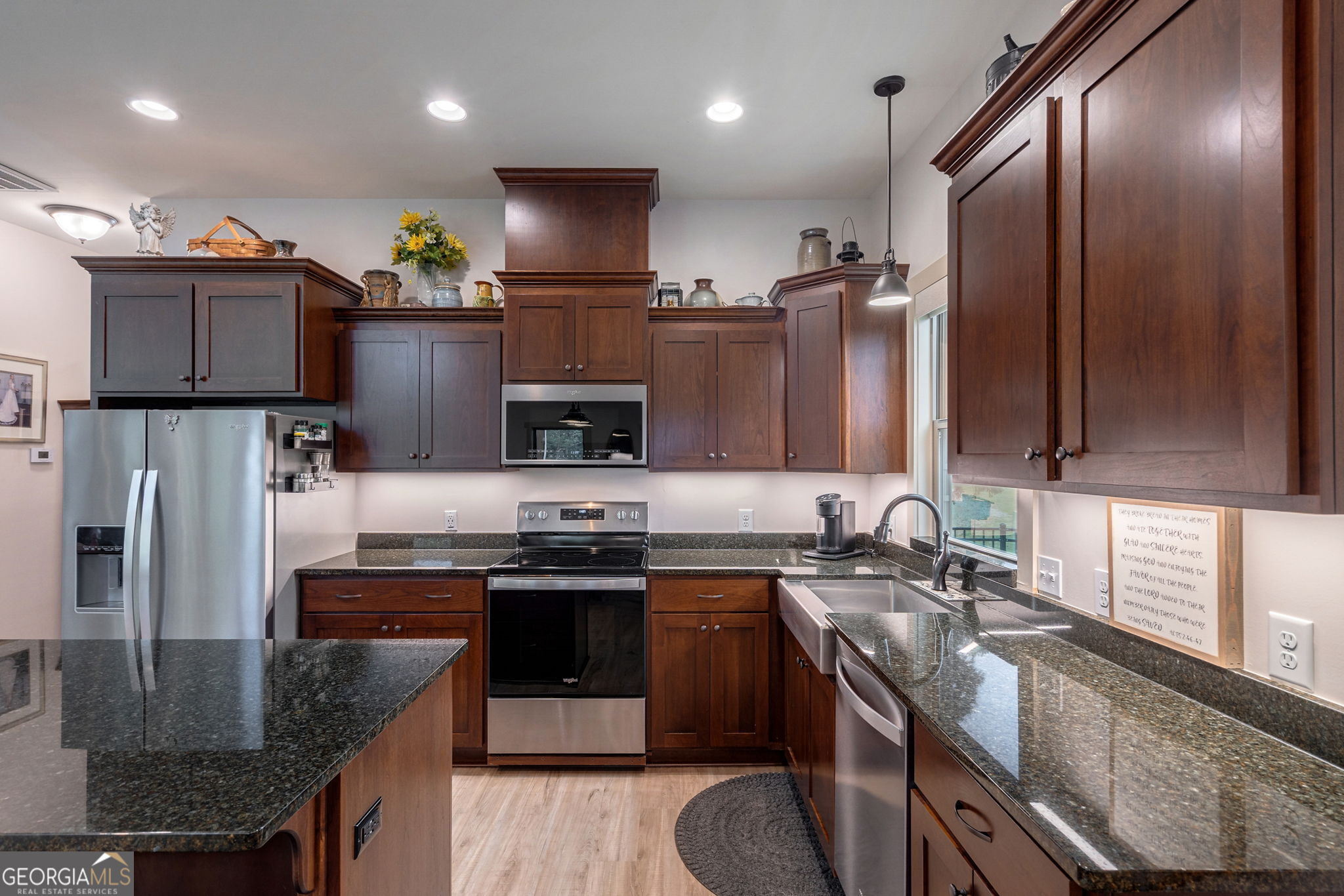 1364 Old Bishop Road Bishop, GA 30621 - Photo 23 of 62 a kitchen with stainless steel appliances granite countertop a sink a stove a refrigerator a microwave a sink and a refrigerator
