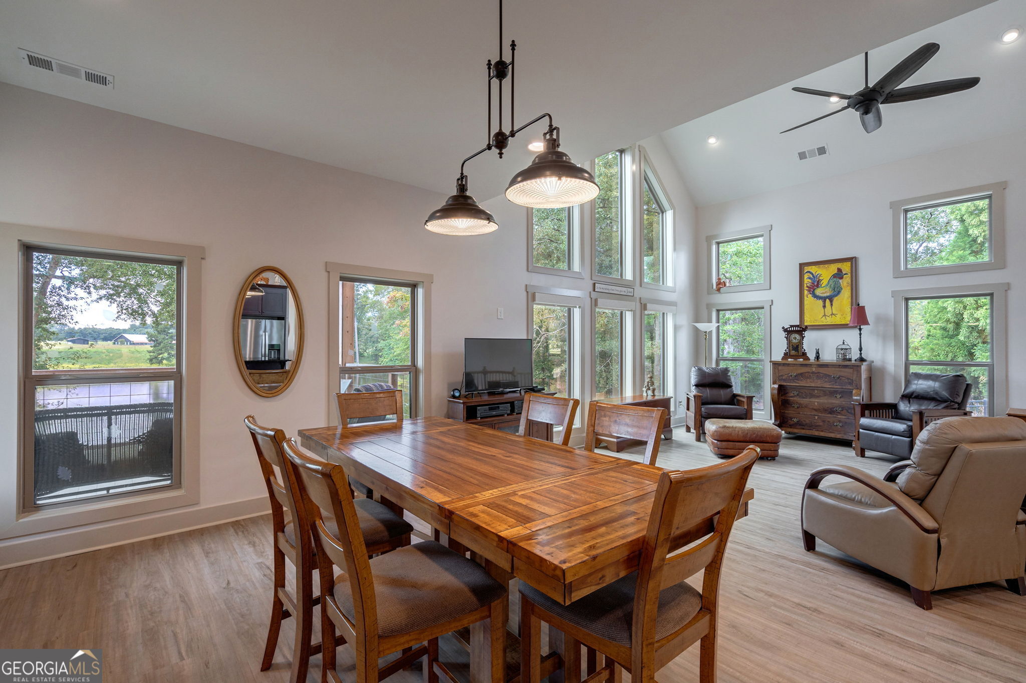 1364 Old Bishop Road Bishop, GA 30621 - Photo 25 of 62 a dining room with furniture a chandelier and wooden floor