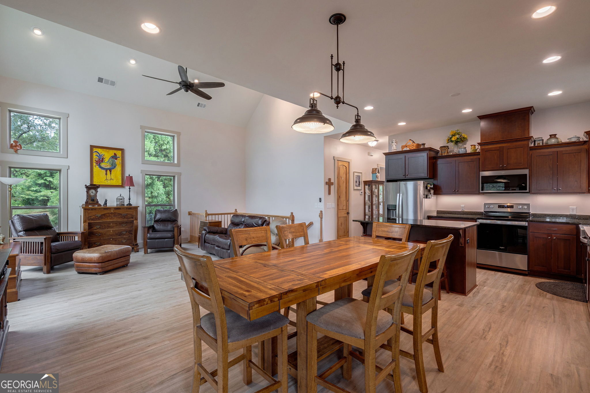 1364 Old Bishop Road Bishop, GA 30621 - Photo 27 of 62 a view of a dining room and livingroom with furniture wooden floor a chandelier