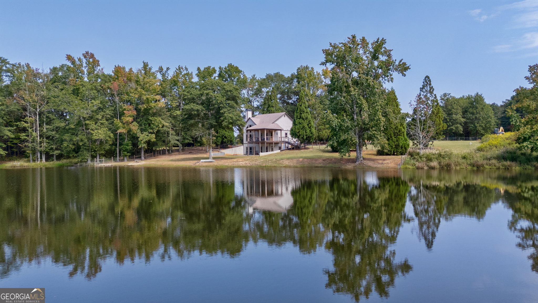1364 Old Bishop Road Bishop, GA 30621 - Photo 49 of 62 a view of a lake with a building in the background