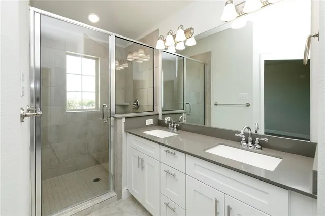 a view of a hallway with closet and bathroom