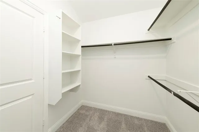 a view of an empty walk in closet