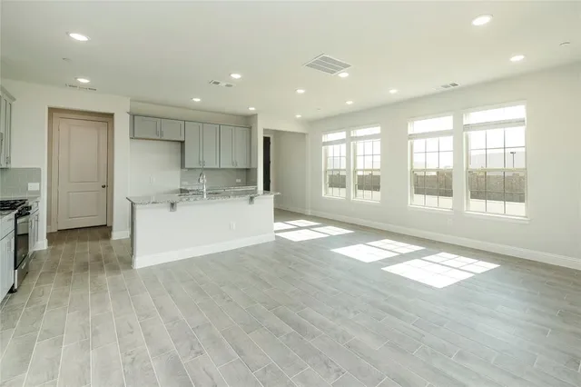 a view of a kitchen with a sink and a window