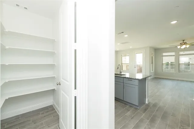 a view of an empty walk in closet