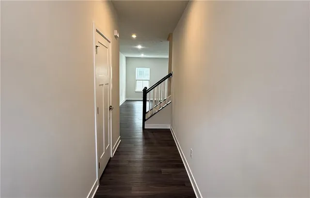 a view of a hallway with the wooden floor