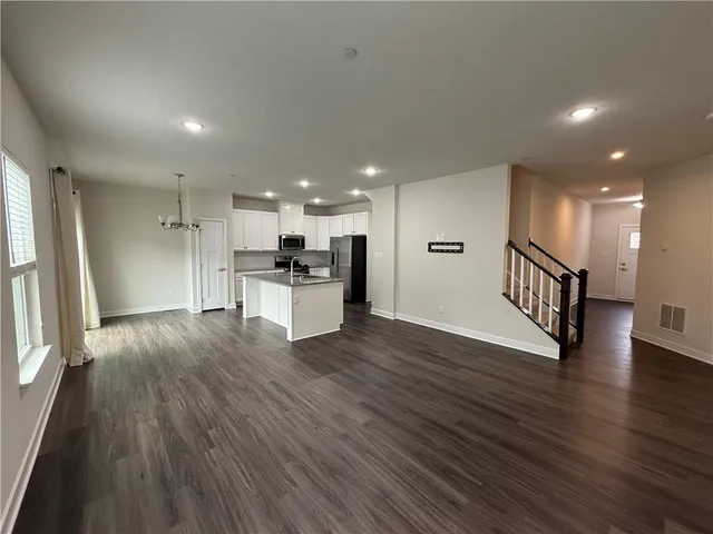 a view of kitchen with wooden floor