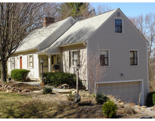 1136 Bay Road Amherst, MA 01002 - Photo 1 of 9 a view of a house with backyard and sitting area