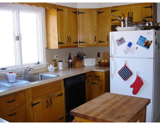 1136 Bay Road Amherst, MA 01002 - Photo 4 of 9 a kitchen with a sink a stove and cabinets