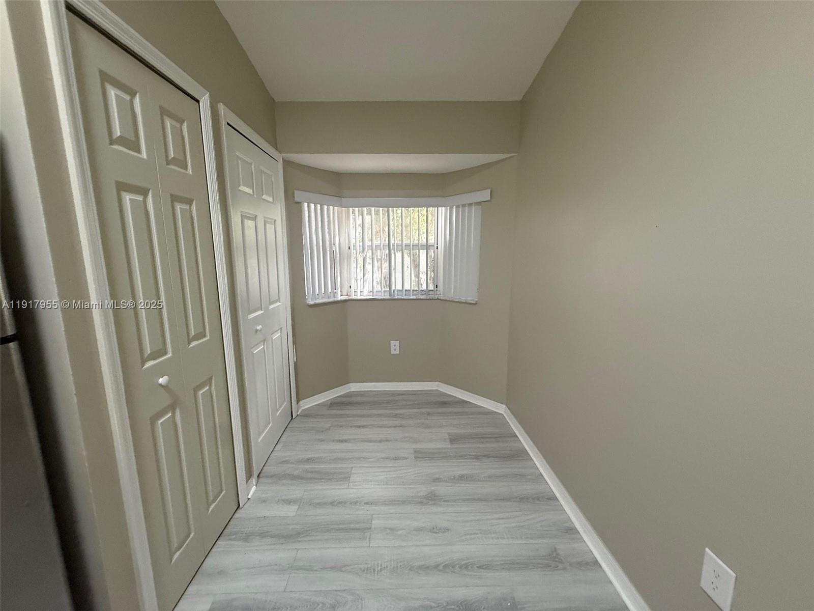 2911 Southeast 13th Road, Unit 20240 Homestead, FL 33035 - Photo 12 of 28 a view of a hallway with wooden floor