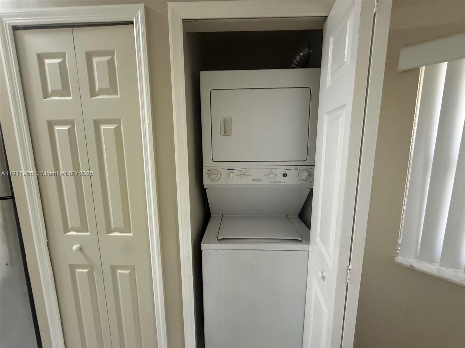 2911 Southeast 13th Road, Unit 20240 Homestead, FL 33035 - Photo 15 of 28 a utility room with dryer and washer