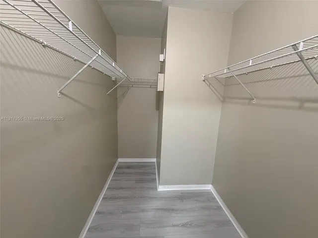 a view of an empty walk in closet