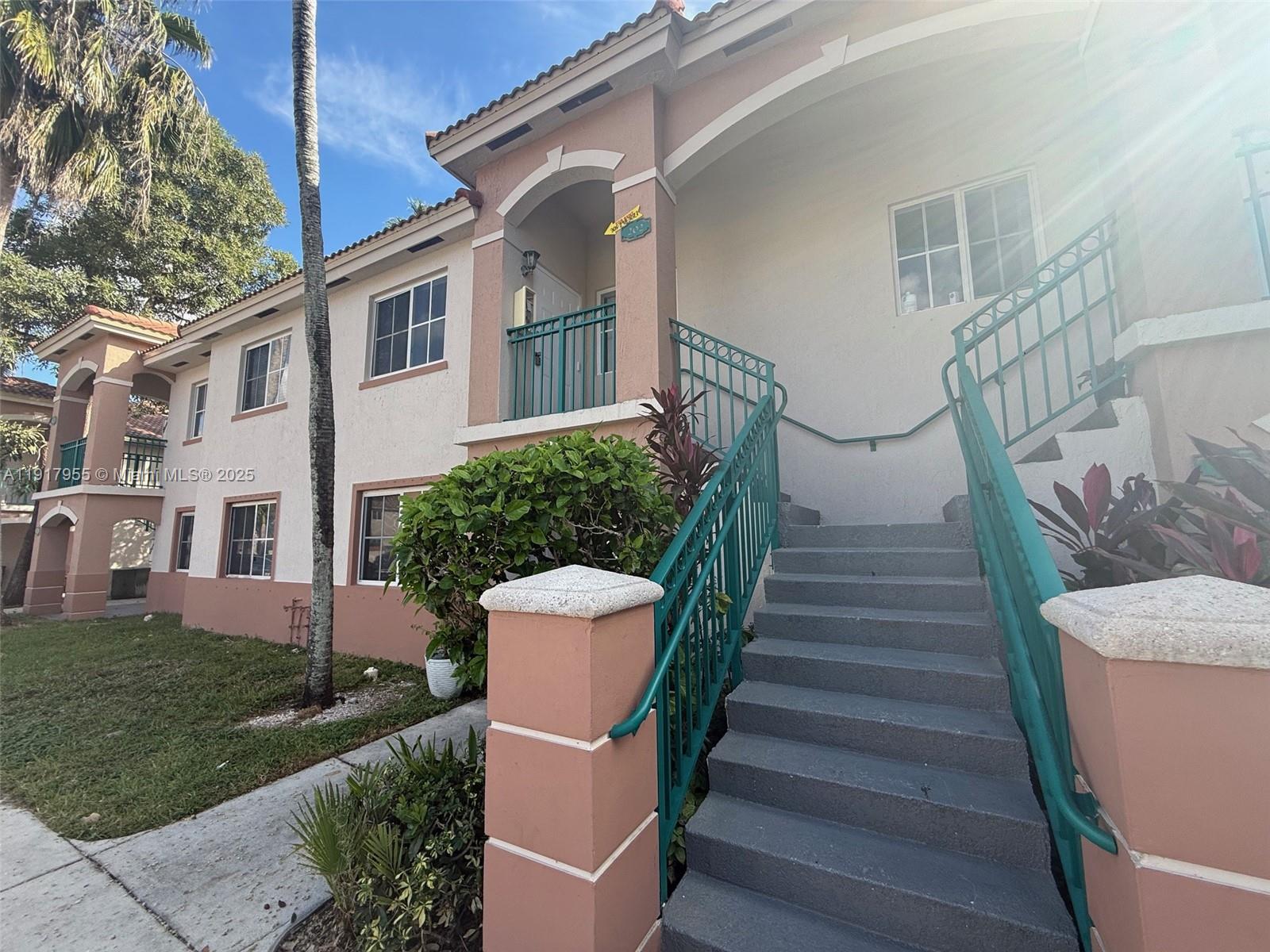 2911 Southeast 13th Road, Unit 20240 Homestead, FL 33035 - Photo 2 of 28 a view of a house with backyard and garden