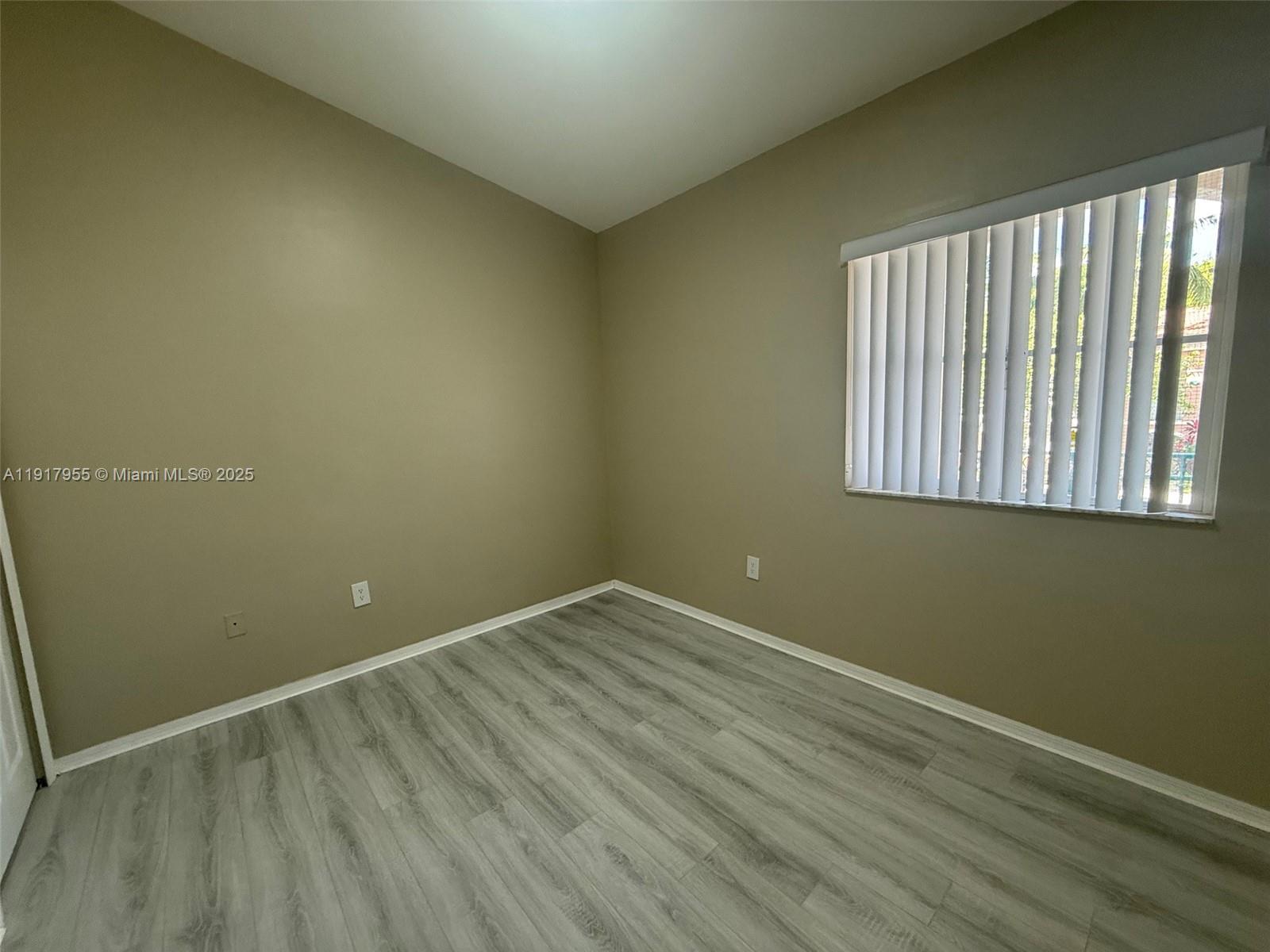 2911 Southeast 13th Road, Unit 20240 Homestead, FL 33035 - Photo 24 of 28 an empty room with a window