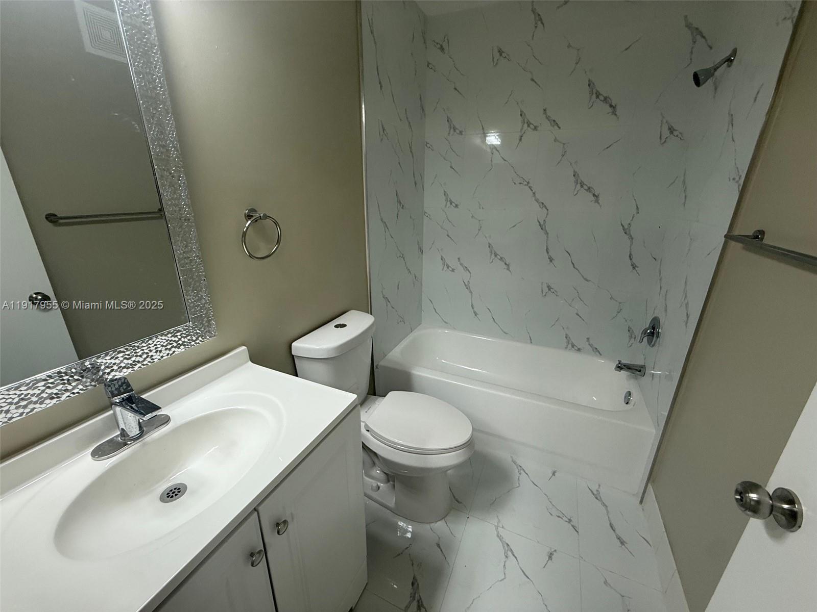 2911 Southeast 13th Road, Unit 20240 Homestead, FL 33035 - Photo 26 of 28 a bathroom with a sink toilet and shower