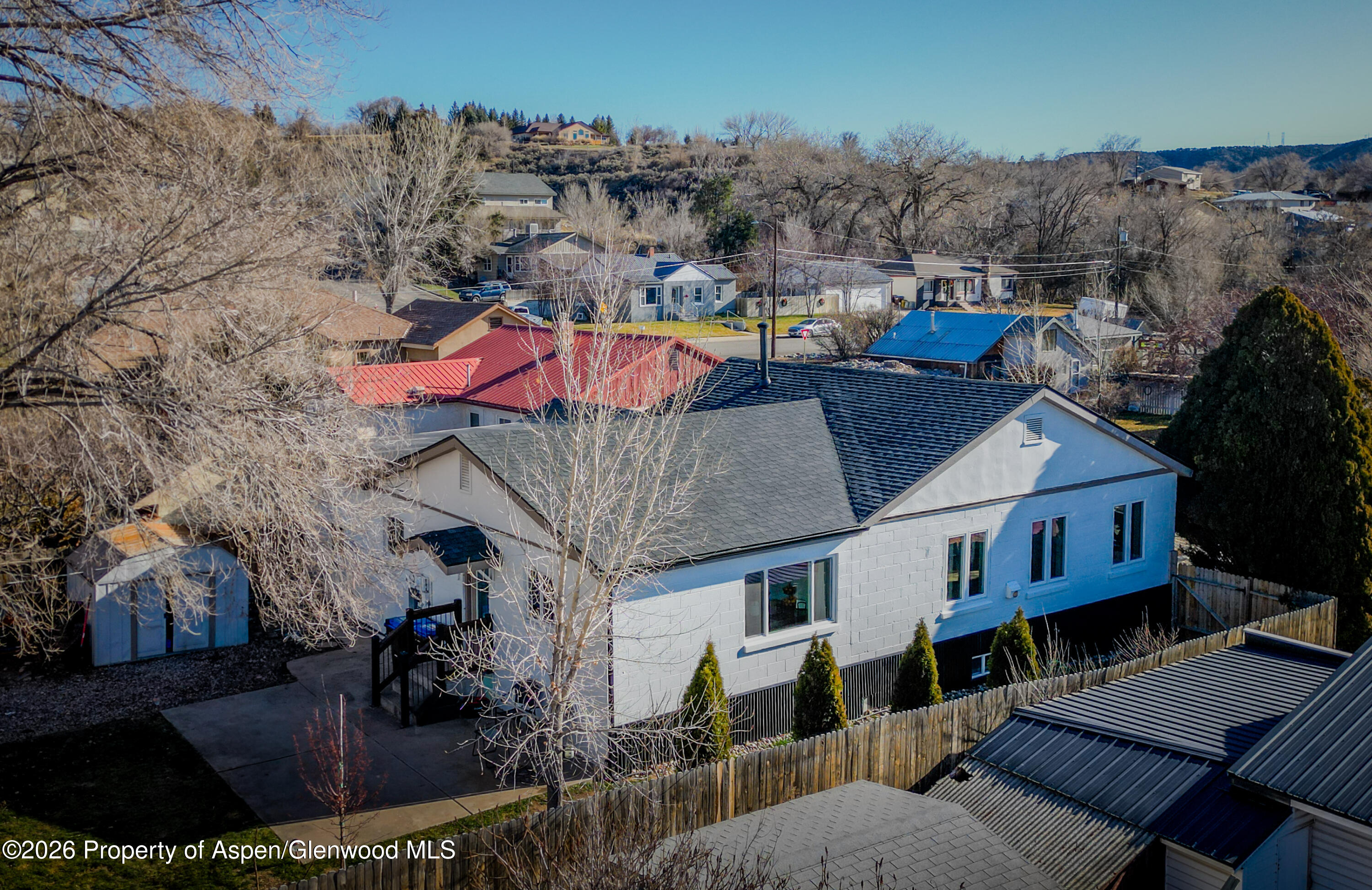 an aerial view of a house with a patio