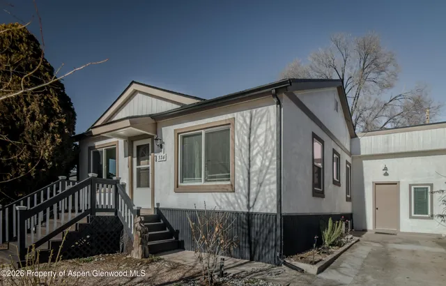 a front view of a house with glass windows