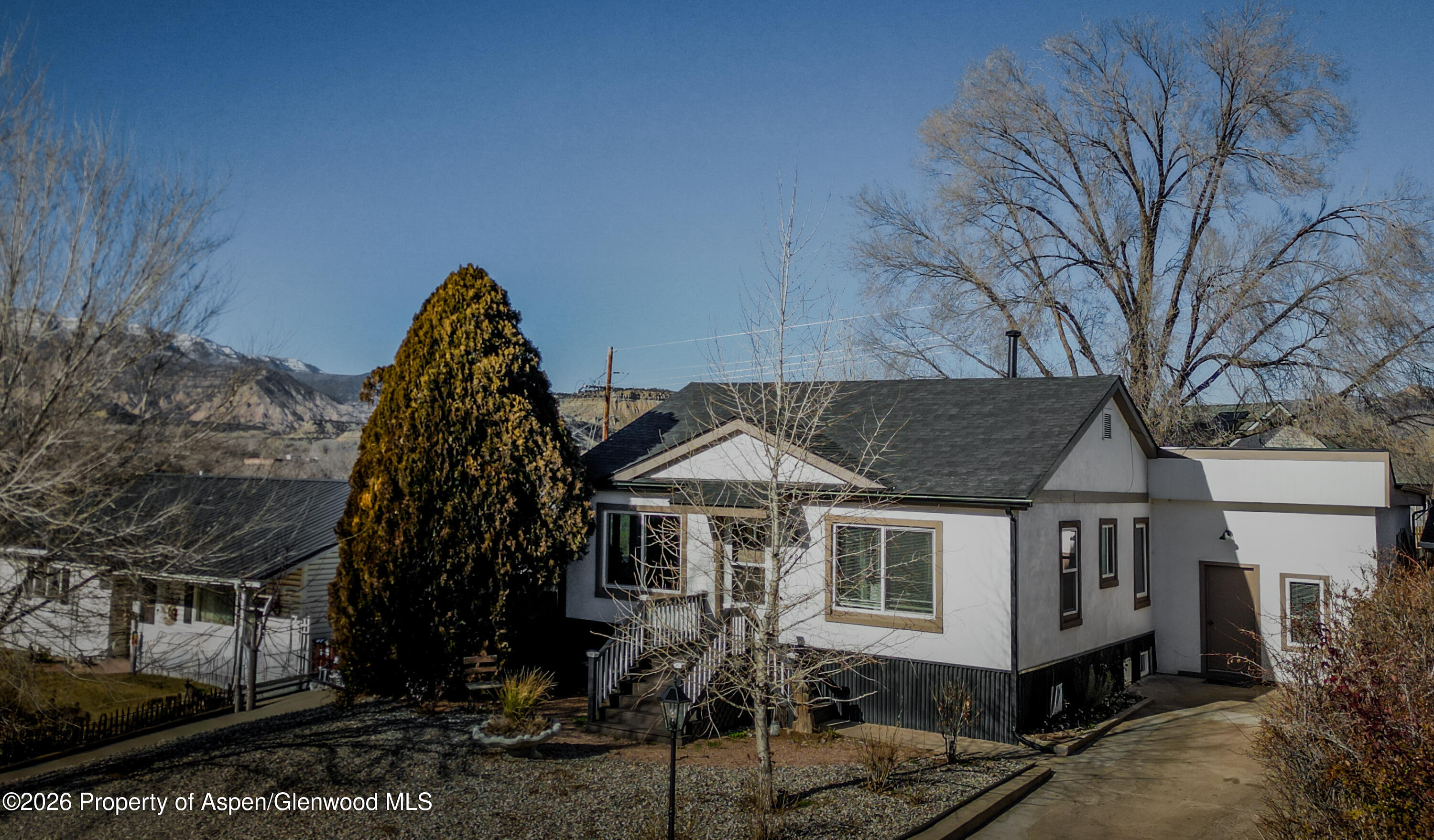 326 East 10th Street Rifle, CO 81650 - Photo 33 of 39 a front view of a house with a yard