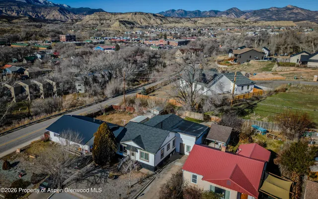an aerial view of houses with yard