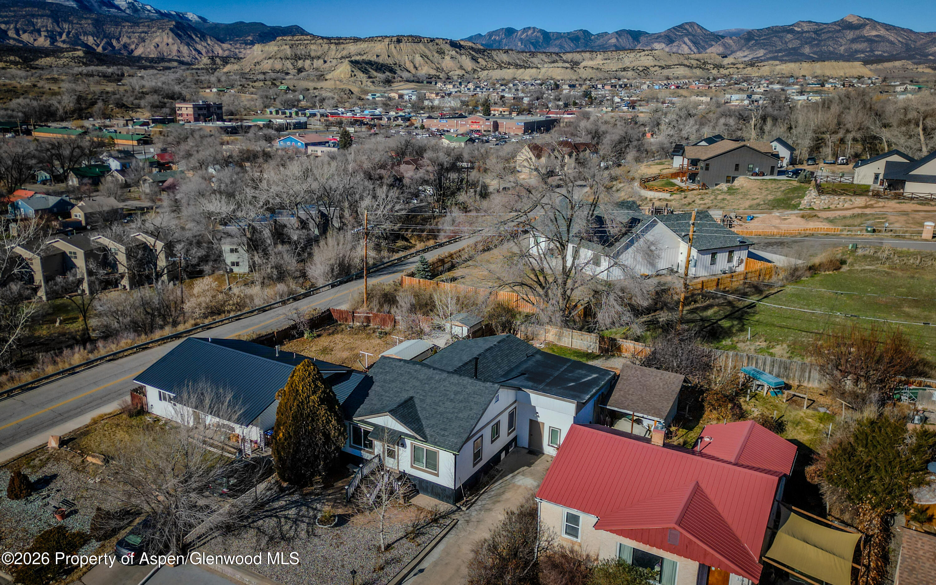 326 East 10th Street Rifle, CO 81650 - Photo 34 of 39 an aerial view of houses with yard