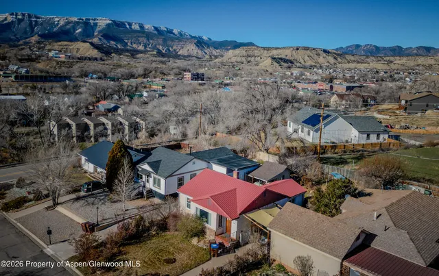 an aerial view of houses with outdoor space